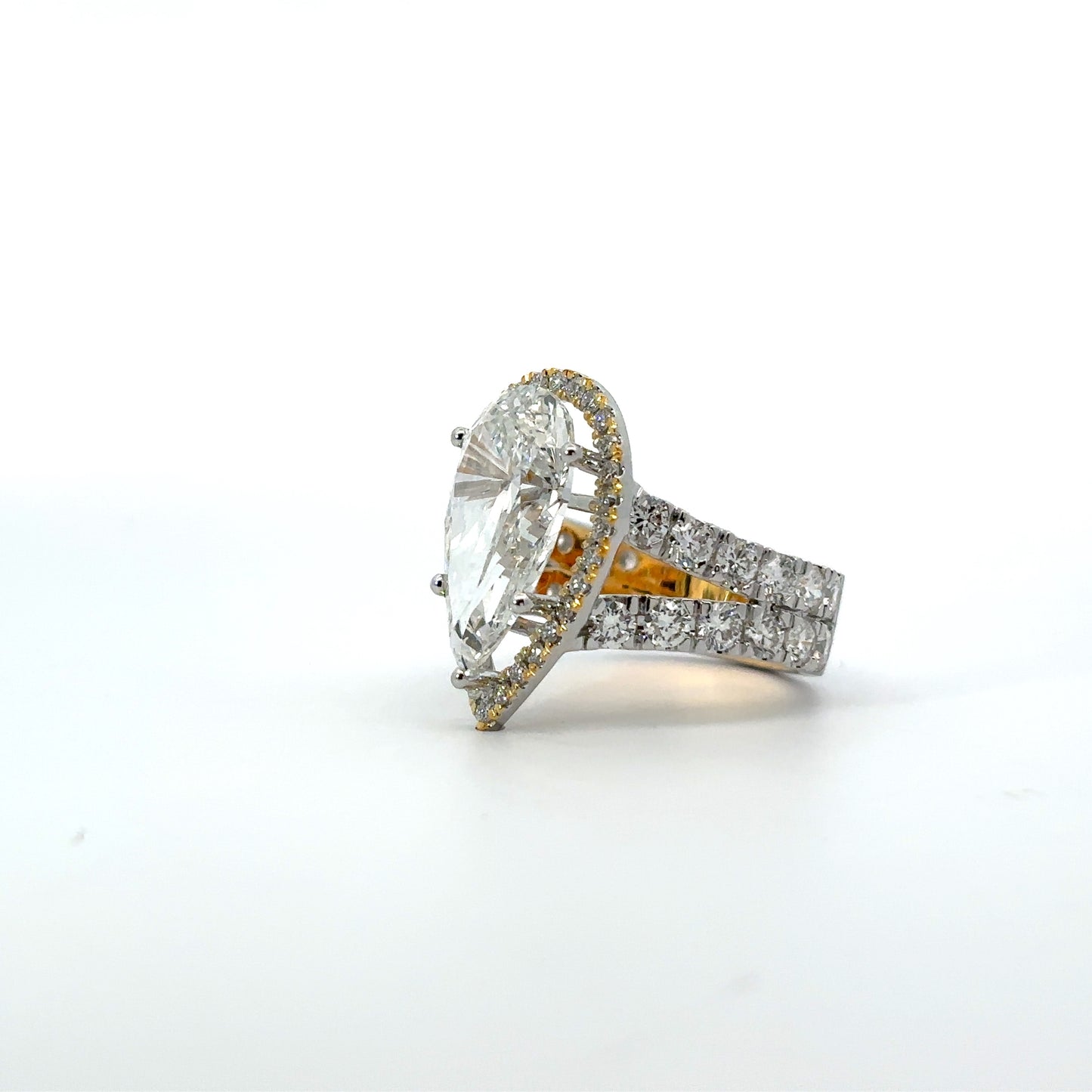 Pear-Shaped Diamond Engagement Ring with Halo and Split Shank Design