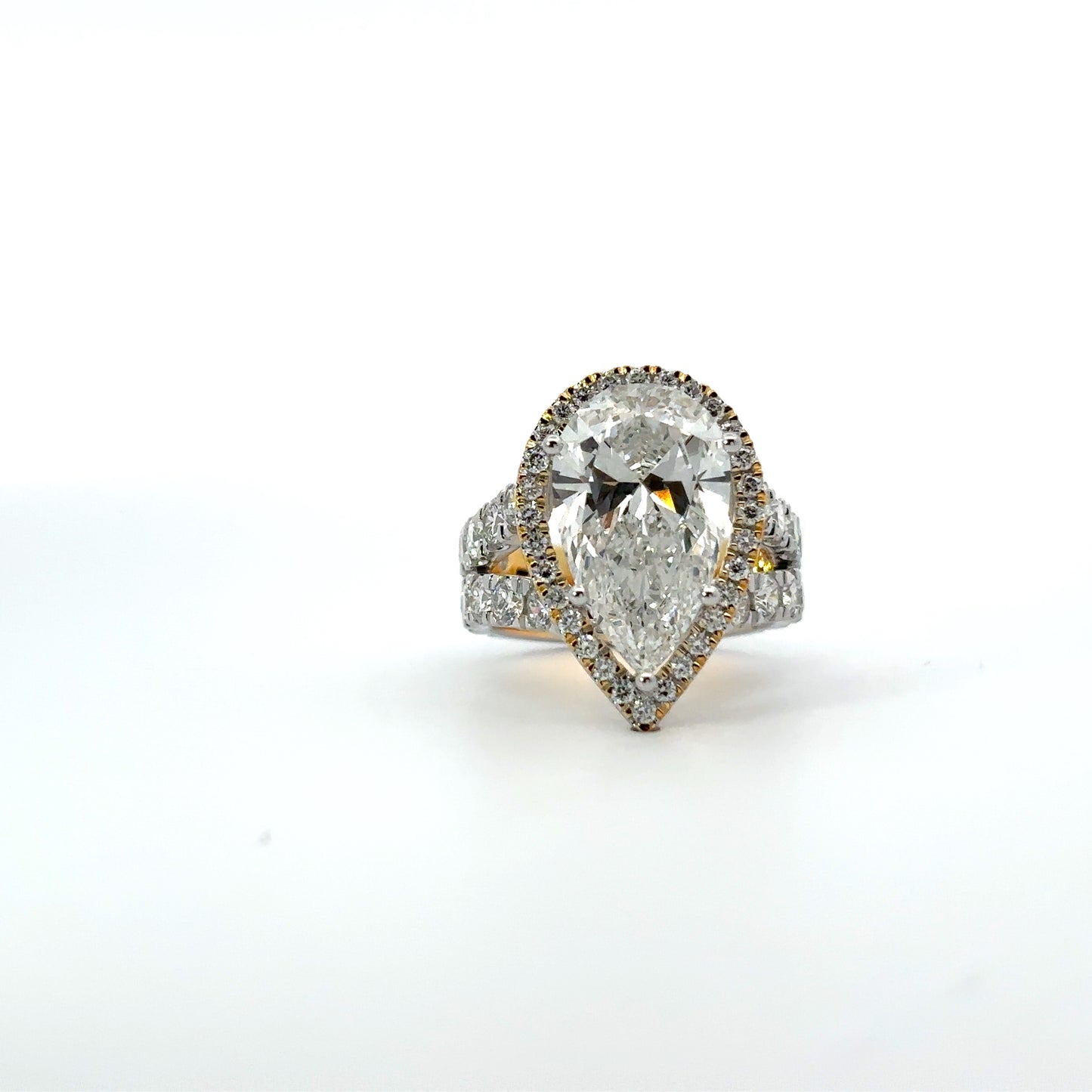 Pear-Shaped Diamond Engagement Ring with Halo and Split Shank Design