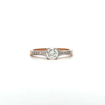 Round Cut Diamond Engagement Ring with Baguette Accents