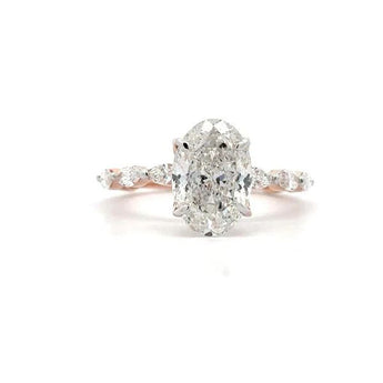 3.272 Carat Oval Cut Diamond Ring with Elegant Side Stone Setting