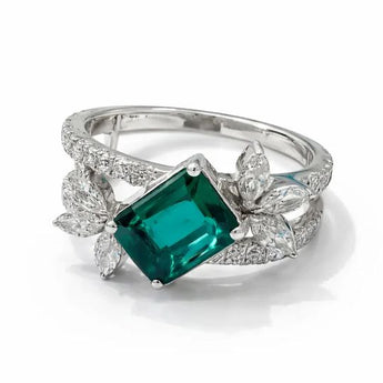 Monumental Emerald Centerpiece Ring with Shimmering Pave Diamond Band