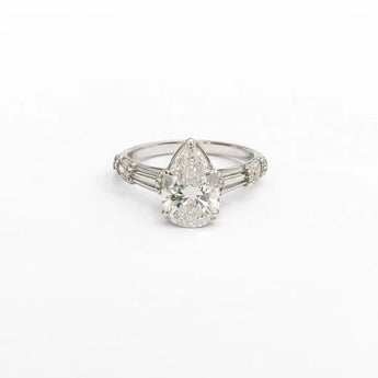 6.47 Carat Pear Cut Diamond Ring with Baguette Side Stones